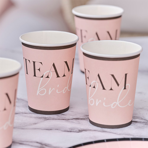 Team bride paper cups on a table
