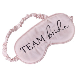 A team bride eye mask against a white background