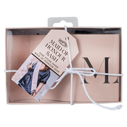 A pink maid of honour sash in a box against a white background