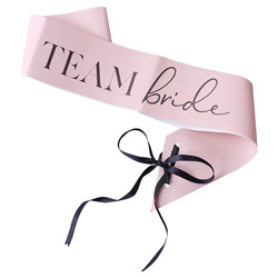 A pink team bride sash against a white background