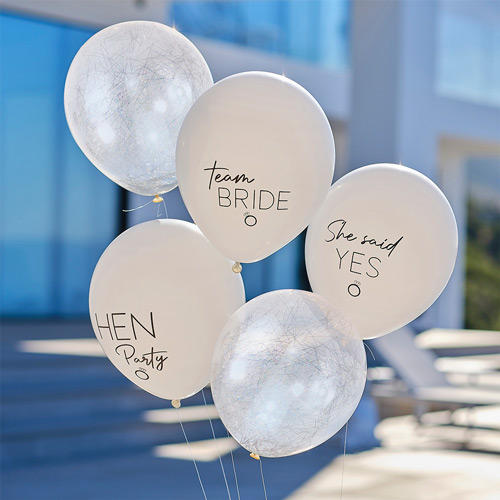A selection of team bride balloons in an outdoor venue