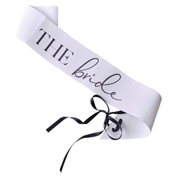 A white bride sash with black ribbon against a white background