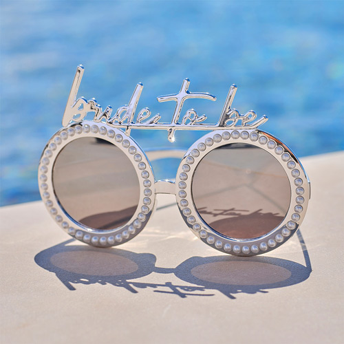 Bride to Be sunglasses sat next to a pool