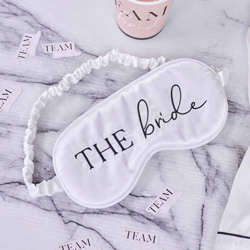 Satin white bride eyemask on a marble background