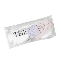 Satin white bride eyemask in packaging on a white background