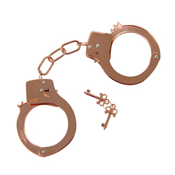 Rose gold handcuffs and keys on a white background