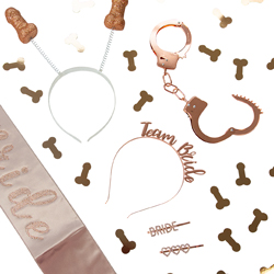 A flatlay of rose gold hen party accessories isolated on a white background