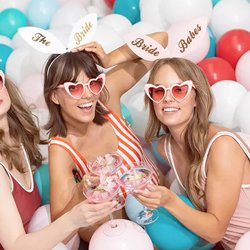 Models wearing Bride Squad Bunny Ears in a blue room