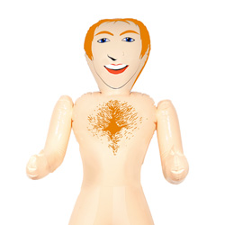 Close up of male ginger blow up doll on a white background