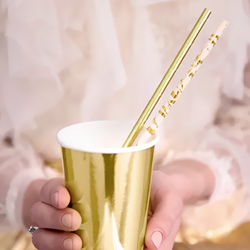 Woman holding a cup with Pink and Rose Gold Foil Paper Straws in