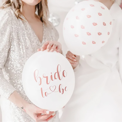 Two women holding Bride to be Party Balloons