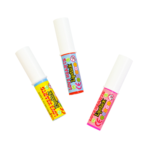 Lovehearts candy lipsticks on a white background
