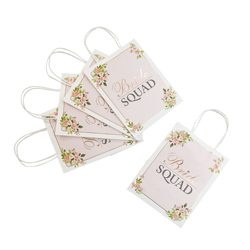 Bride Squad Floral gift bags laid flat on a white background