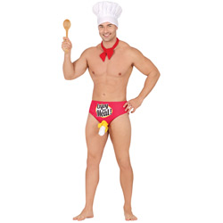A topless male model wearing a chefs hat and holding up a wooden spoon 