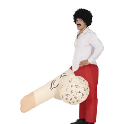 A side view of a male model wearing an inflatable cock and balls that's bursting from out of his red trousers which he is wearing with a white shirt, black wig and moustache 