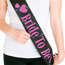 A black and pink bride to be sash