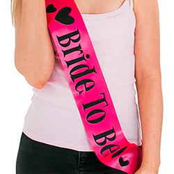 Bright pink sash with black writing