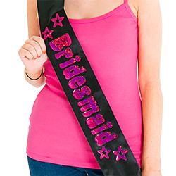 The sash looks great against the hot pink vest top