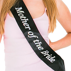 A black sash on a light pink vest top