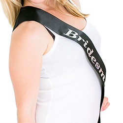 A model in a white top modelling a black sash