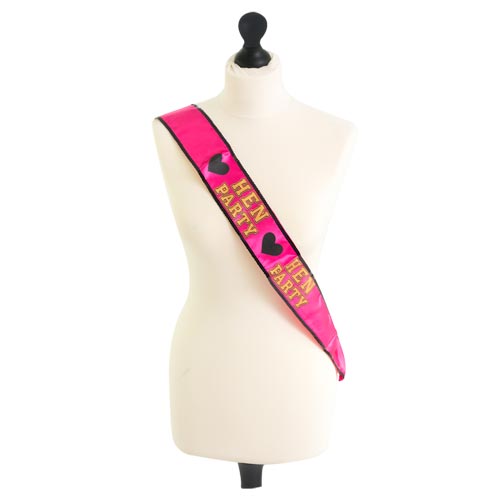 A pink and gold hen party sash on a mannequin