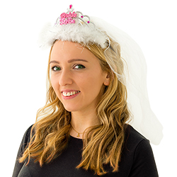 A girl wearing a Bride to Be tiara with the veil over her head