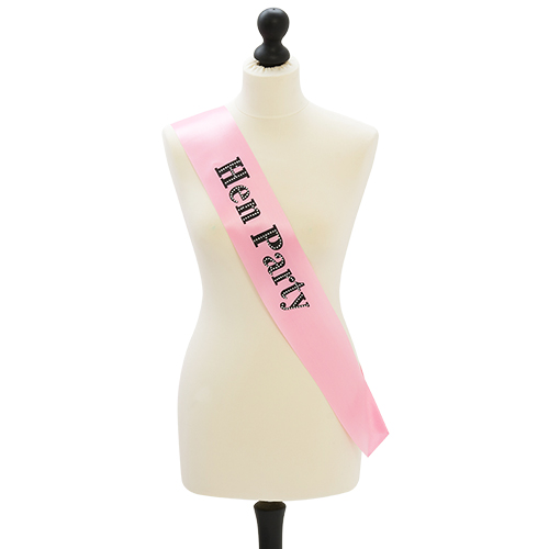 Pink hen party sash with black text and diamante design.