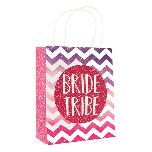 A purple and pink Bride Tribe bag standing up