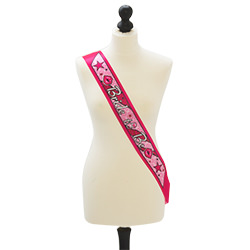 A hot pink bride to be sash on a mannequin 