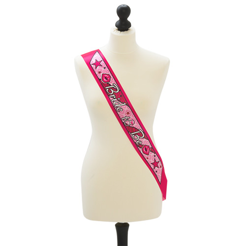 A hot pink bride to be sash on a mannequin 