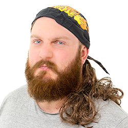 A man looking angry, wearing a Hell's Angel mullet with bandana