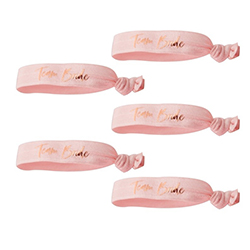 Team bride wristbands in pink with rose gold writing.