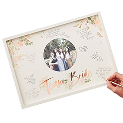Floral team bride frame with messages being written.
