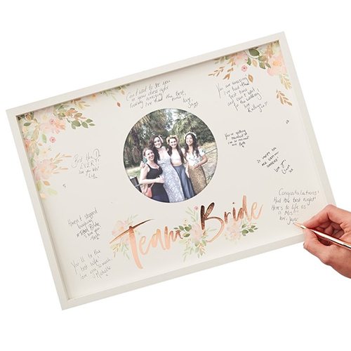 Floral team bride frame with messages being written.