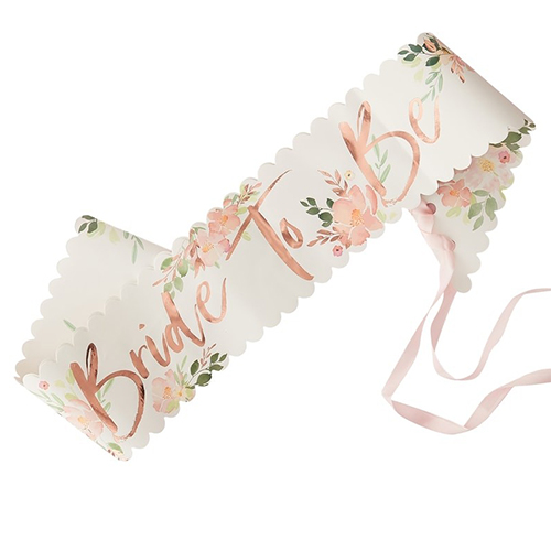 The bride to be floral sash tied together with pink ribbon.