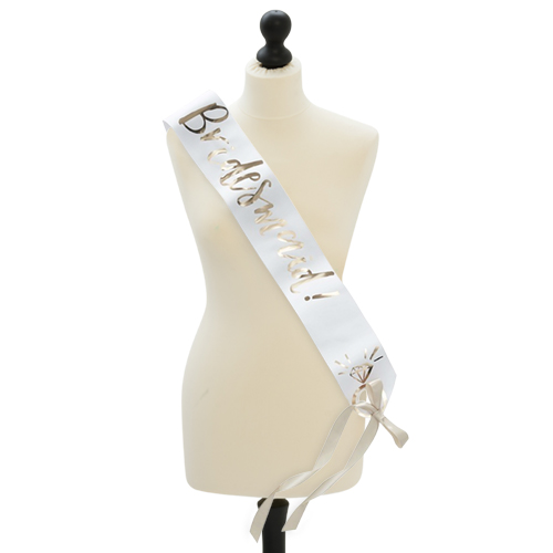 The white and gold sash seen on a mannequin