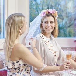 A lifestyle picture of a bride wearing the veil.