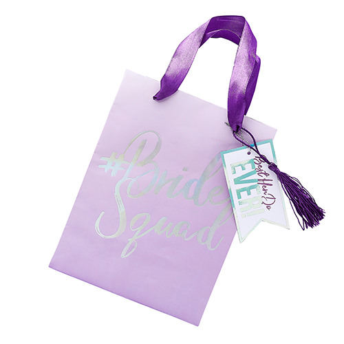 A purple bride squad gift bag.