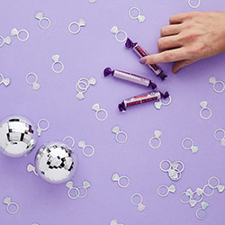 Lifestyle image including mirror balls and Parma Violets.