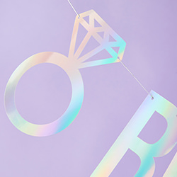 Diamond ring designs on either side of the writing.