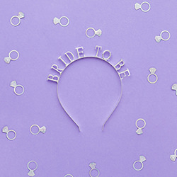 Bride to be headband on a purple background with confetti.
