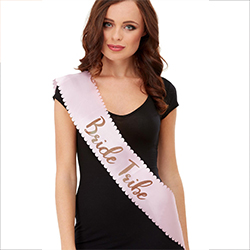 Pink sash with rose gold team bride text.