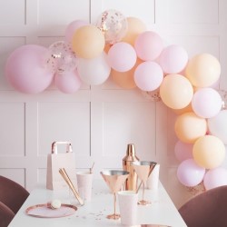 The balloon arch with a table set beneath it.
