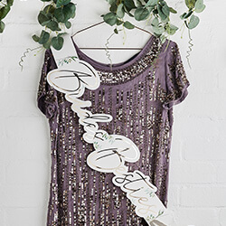 The sash laid out flat on a table.