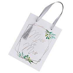 A white back with silver tassel and flower design.