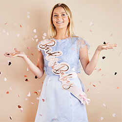 The sash worn by a girl in a blue dress.