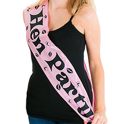 A model wearing the pink hen party sash