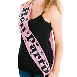 The black text stands out against the pink sash