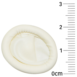 Against a ruler showing that they are around 2cm in diameter