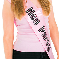 The model smiles while wearing the item